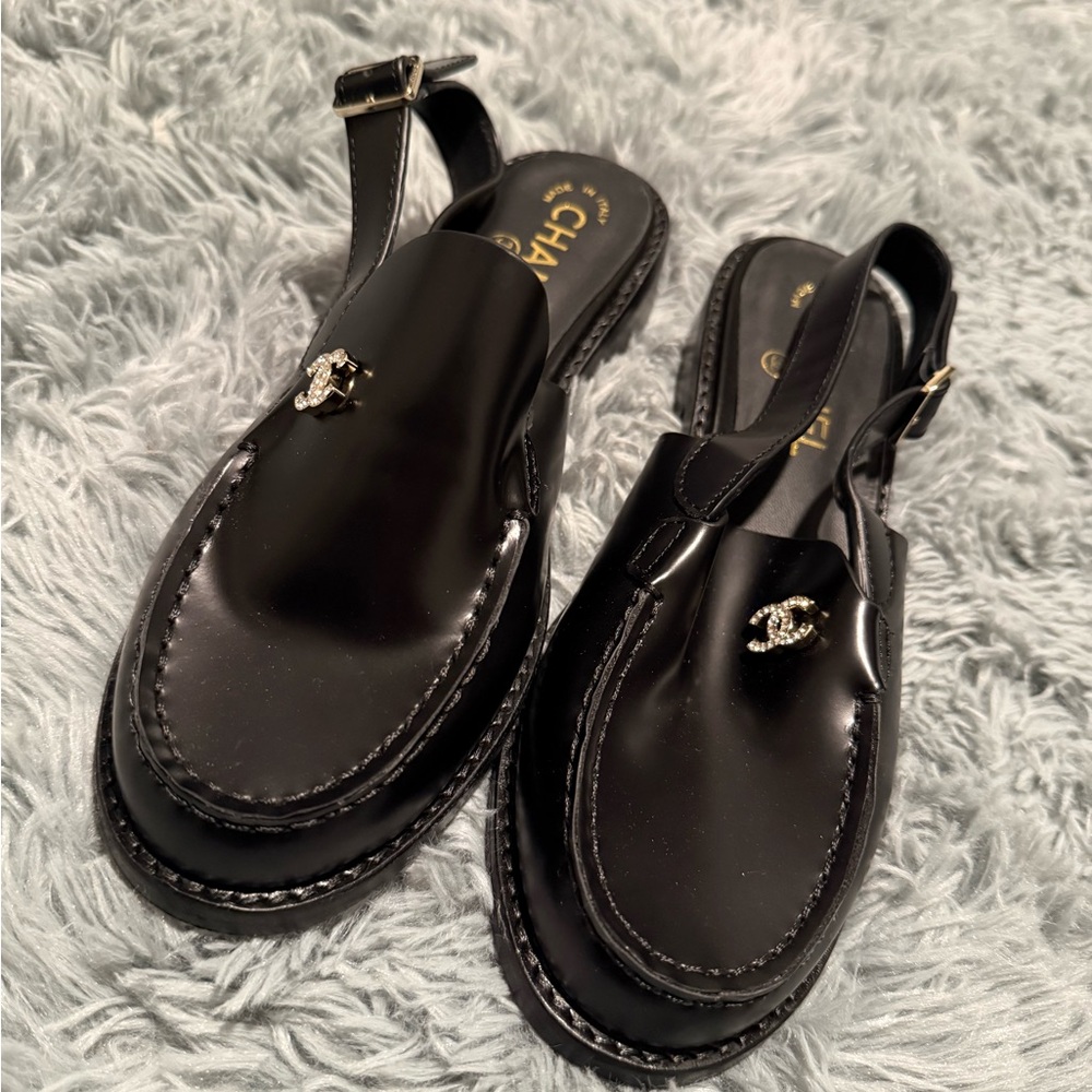CHANEL Black Mules with Silver Logo Detail